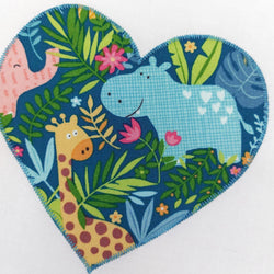 a heart shape of jungle fabric showing a smiling hippo, a giraffe and a hippo 