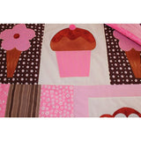 patchwork squares of pink, cream and brown. There are brown and pink ice creams and a large pink cupcake sewn on the squares