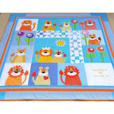 the whole jungle quilt showing the lions, lionesses and cubs with flowers and also embroidery of the name and birth date of the baby