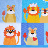 5 lions and lionesses with a cub wearing glasses all on different coloured blue fabric backgrounds